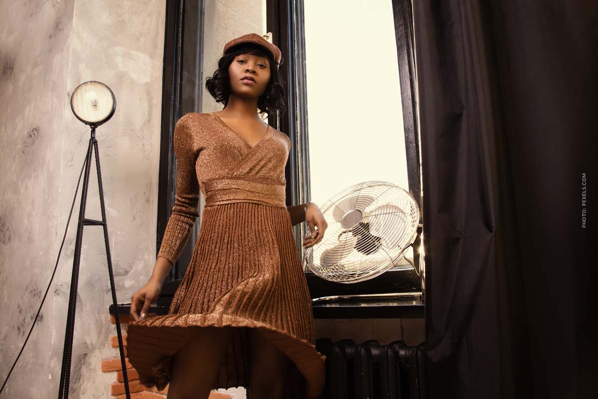 roberto-cavalli-woman.in-loft-wearing-a-sparkling-brown-dress-looking-into-the-camera